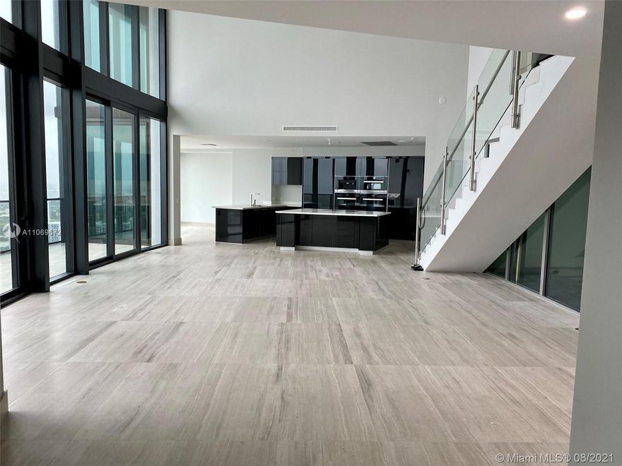 Exclusive one of only 16 duplex residences in the Porsche Design Tower. Completed with marble flooring, living & summer kitchen area, double ceiling living room & balcony, dining room, separate TV room on the 2nd floor, 2 private elevators, 542 SqFt of private sky garage with 2 parking spaces attached to the unit accessed by high tech car elevator, Miele appliances including wine cooler, induction cooktop, speed-microwave oven and warming drawers. Automatic Toto toilets with integrated bidet functions.  Amenities: Oceanfront gym & spa, pool & beach service, restaurants, theater, virtual golf, 2 race car simulators, private wine lockers, 24h valet, 24h exclusive concierge services and more.