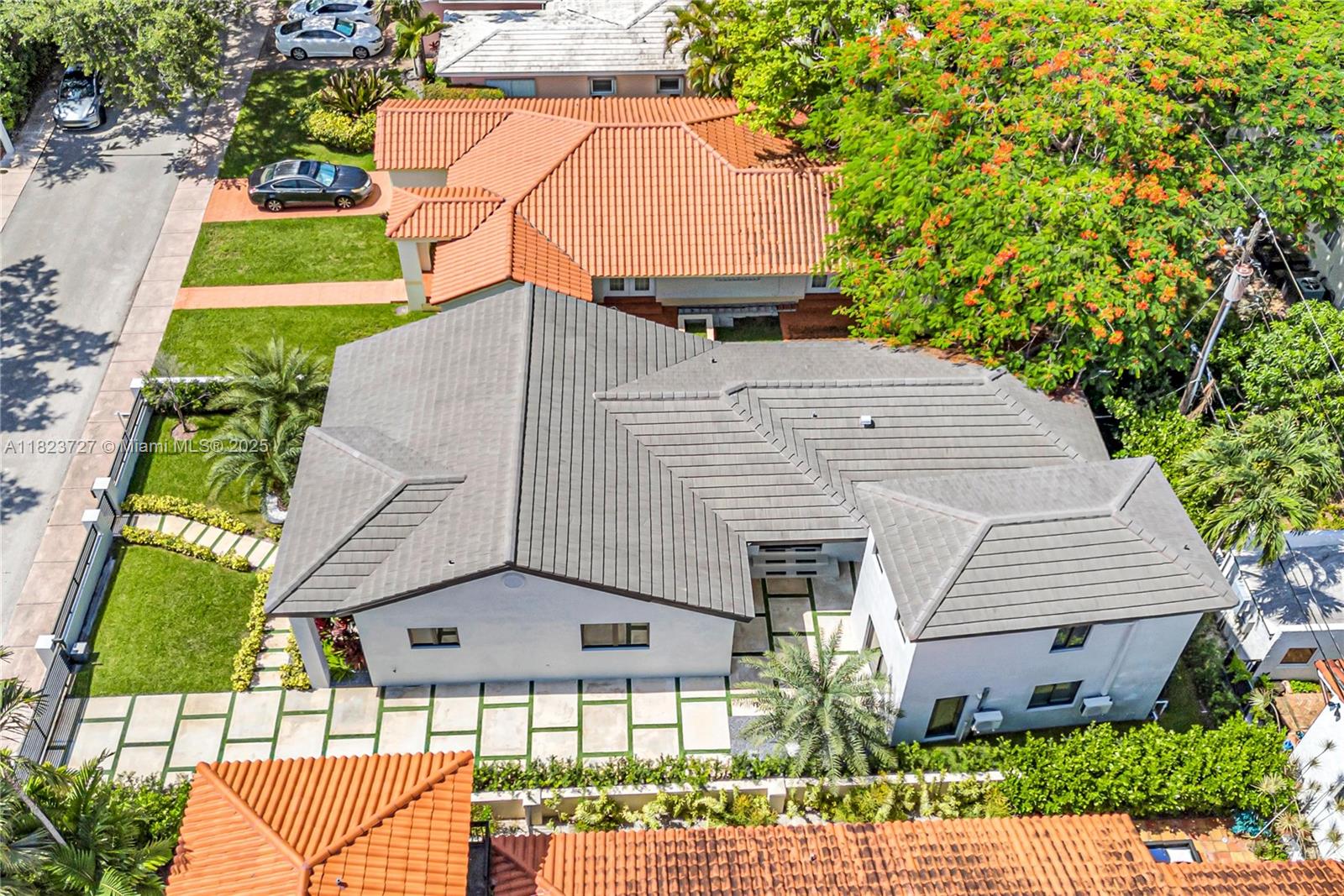 Luxury living meets exceptional versatility. A fully remastered sanctuary blending timeless elegance with modern sophistication. Nestled in a prime location in Coral Gables on a closed street, this exquisite property features a beautifully renovated 3-bedroom main house paired with a detached guest house offering two private efficiency suites—ideal for multigenerational living or hosting guests. Discover an ideal design, cathedral ceilings, Italian porcelain tile throughout, LED lighting, and high-end finishes. The chef's kitchen boasts premium appliances, custom cabinetry, and sleek countertops, seamlessly connecting to expansive living and dining areas—perfect for entertaining. Outside, enjoy meticulously landscaped grounds, private outdoor living areas, and a privacy gate.