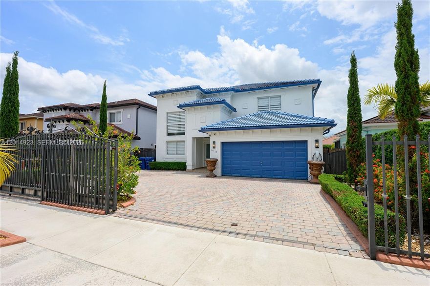 Stunning modern residence featuring sleek contemporary design, high ceilings, and an exceptional indoor outdoor lifestyle. This beautifully maintained two story home offers 4 bedrooms and 3.5 baths. The garage has been converted to accommodate in-laws or generate extra income. Featuring high ceilings, elegant porcelain flooring, modern stair railings and abundant natural light throughout this home is designed for everyday living and entertaining. Four spacious bedrooms all on the second floor feature warm wood style flooring and generously sized closets. Step into the backyard oasis featuring a sparkling pool and spa, expansive covered terrace and well equipped outdoor kitchen. This is a great turn key property schedule a showing and come see it for yourself.