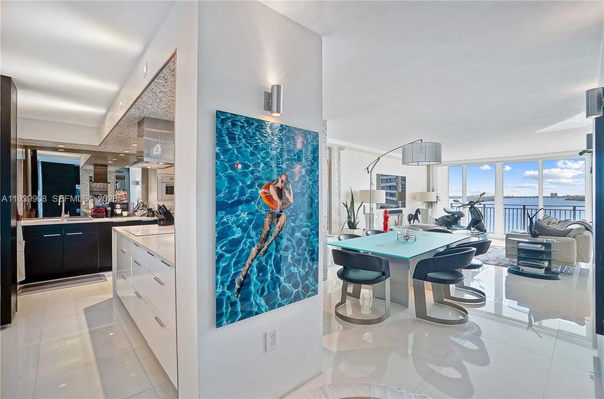 TURNKEY-Gorgeous, chic, and iconic 1-bedroom, 1.5-bath convertible (previously a 1-bedroom + den). Perfection!

This stunning residence features floor-to-ceiling impact glass, a beautifully remodeled kitchen, updated flooring throughout, remodeled bathrooms, and an in-unit washer and dryer.

Enjoy breathtaking panoramic Biscayne Bay views from every room, overlooking Palm Bay Marina, the bay, beaches, and the downtown Miami skyline. Palm Bay Condo is ideally located on the edge of Biscayne Bay, offering the ultimate luxury Miami lifestyle.

Additional features include a spacious open balcony accessible from both the living room and bedroom,  and generous spacious walk-in closet.

Excellent as a corporate living unit. Move-in ready!