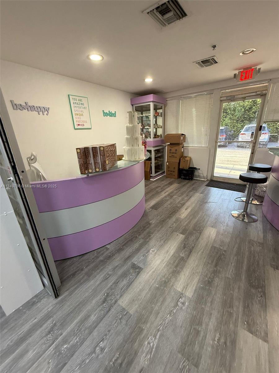 Located in the heart of Doral on busy NW 79th Avenue with excellent visibility from Palmetto Expy. THIS PROPERTY IS A PERFECT FIT FOR ACADEMIES OR BUSINESSES THAT OFER INSTRUCTIONAL WORKSHOPS AND SELL PRODUCTS ON-SITE. Fully furnished and move-in ready, this unit features a stylish reception area and a spacious showroom with wall-mounted display panels - perfect for showcasing products. In the back section, you'll find a multipurpose space with a modern, fully equipped kitchen and stainless steel tables with stools, ideal for hosting classes or demonstrations. All areas are fully air-conditioned, featuring two independent A/C units. NEED ADDITIONAL OFFICE/STORAGE SPACE? The adjacent unit (MLS#A11799720) is also available for rent at a special price when leased together. Same Landlord.