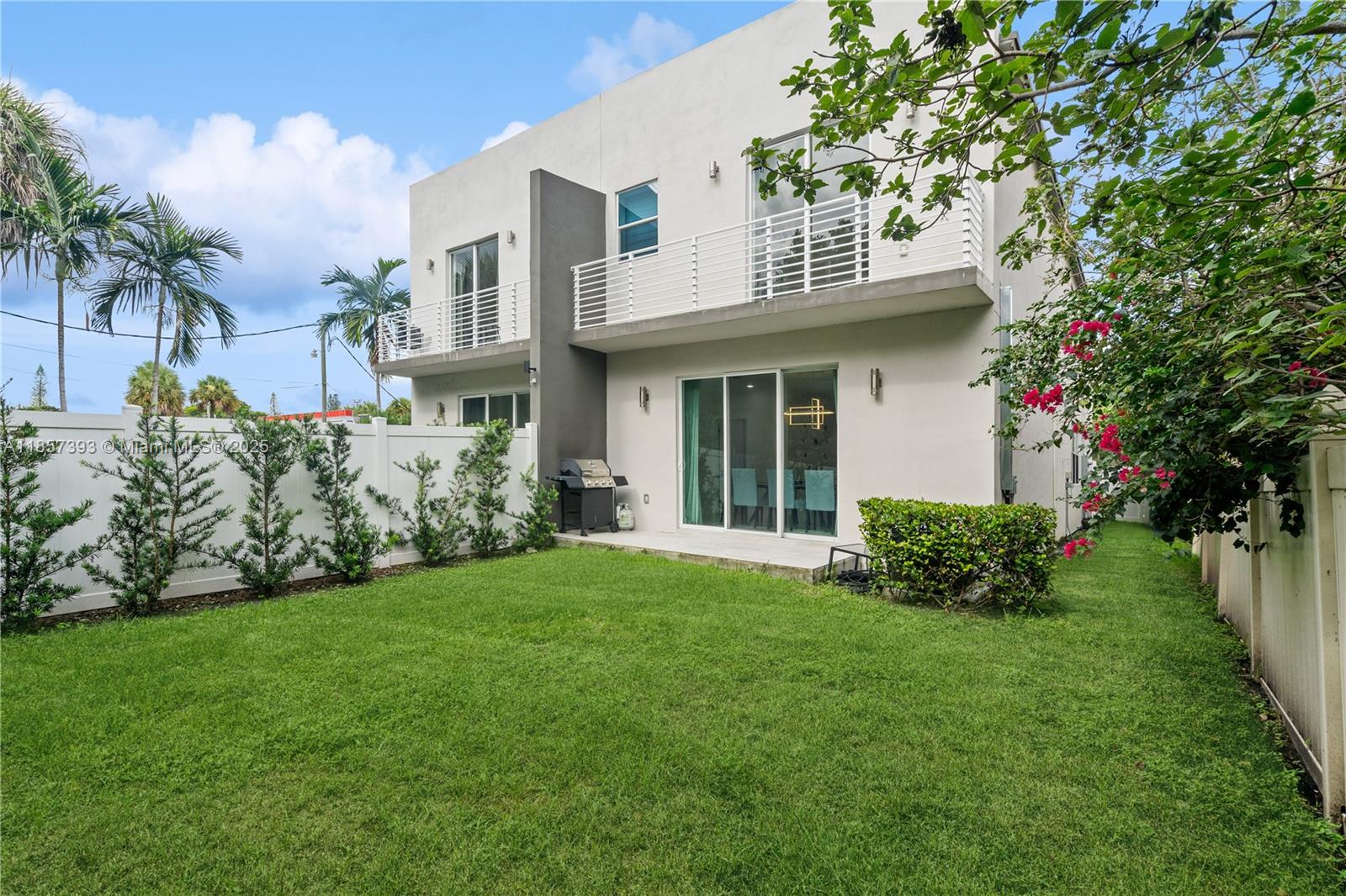 PRICED TO SELL! - NO HOA! Experience the freedom of no fee and no rental restriction in a thoughtfully designed 3 bedroom, 3 bathroom split floor plan. A versatile den invites creativity, perfect as a home office, media lounge, or playroom. This beautiful, newly constructed home is ideally situated just a short 5-minute drive from Fort Lauderdale Beach. The open concept kitchen, boasting quarts waterfall countertops, stainless steel appliances and a wine cooler, seamlessly integrates with the living and dining areas, creating an inviting space for everyday living and entertaining. Step outside to your fully fenced, private backyard offering endless opportunities. This fee simple attached single family home offers you full ownership of the structure and the land!