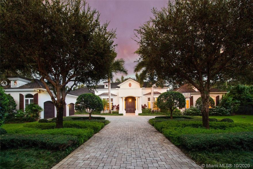 A sensational rare GEM! Transitional & Classic! Elegant & exquisite grand estate with all modern luxury!Gated on over 1.15 deep lush acres in sought after N Pinecrest! Spectacular & imposing entry! Soaring volume ceiling, gleaming marble & hardwood floors .Gorgeous formal living & dining rooms. Library/Office. Gourmet epicurean dream kitchen w/ top of line appliances! Lavish master suite w/sep.gym. Striking his and hers baths w/dressing area! Children's qtr with music/sitting area & playroom! Fabulous familyroom! All rooms w/pretty vistas !Reflecting and inviting oversized pools! Outdoor entertaining suited with full summer kitchen!. Sep.one bed guest quarter w/lovely bath! 3 car garage w/addl.carport! Luxurious appointments w/finest finishes throughout! Much more! Truly A MASTERPIECE!!!