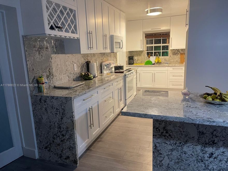 Located on a quiet street, close to schools, major highways and shopping! Great backyard for entertaining. Less than a mile away to SR826, I95 and Turnpike. NO ASSOCIATION.