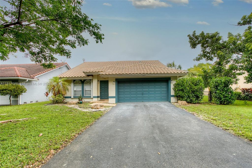 Photo of 10631 NW 32nd Ct, Coral Springs, FL 33065 (MLS # A11817089)
