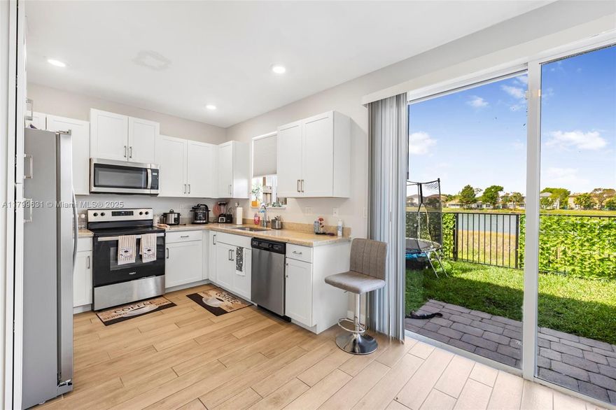 Discover this beautiful townhome in a gated community in Homestead. With 3 bedrooms and 2.5 bathrooms, it features an open living and dining area ideal for entertaining. The primary bedroom includes spacious walk-in closets, and the home is full of modern upgrades. Washer and dryer are included. Enjoy comfort, style, and privacy in a well-maintained neighborhood with no backdoor neighbor and a stunning lake view—perfect for families or anyone looking for a move-in ready home.