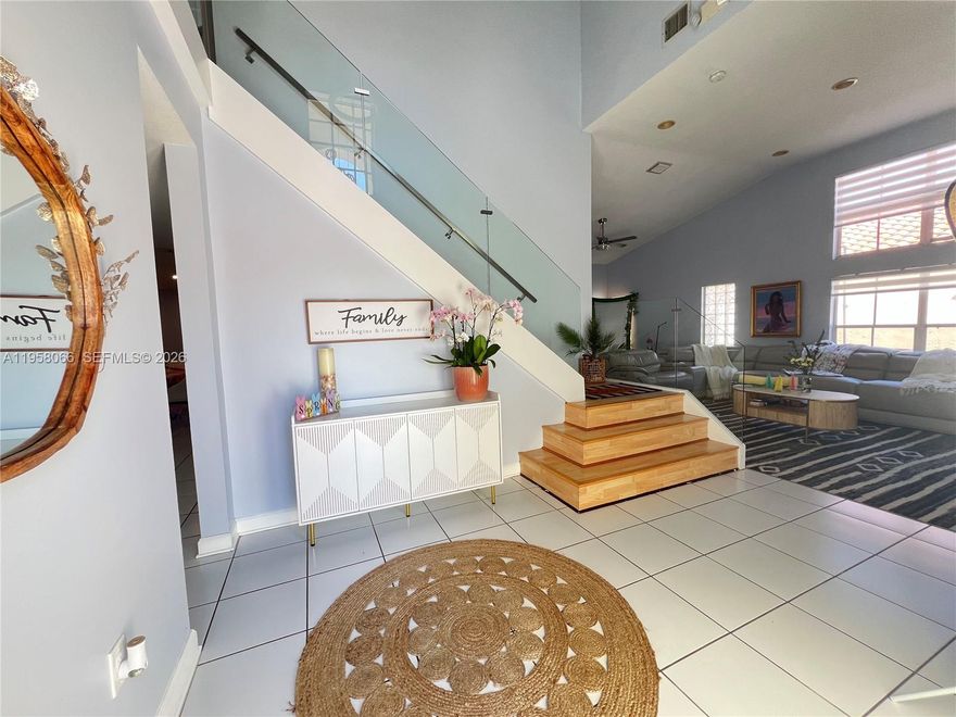 Experience refined Miami living in this beautifully appointed 4-bedroom, 3-bathroom residence with a 2-car garage, perfectly situated in the heart of Westchester. This thoughtfully designed home offers an elegant blend of comfort, space, and versatility, featuring a private downstairs bedroom with full bath and separate entrance—ideal for guests, multigenerational living, or a home office suite. The main living areas are filled with natural light and designed for effortless entertaining. A stylish open-concept kitchen with a breakfast nook flows seamlessly into the living and dining spaces, creating a warm yet sophisticated setting for gatherings. Upstairs, spacious bedrooms provide privacy and comfort, including a serene primary suite designed as a true retreat. Enjoy a prime location just minutes from FIU, Belen Jesuit Preparatory School, Christopher Columbus High School, premier shopping, dining, and easy access to Doral and major expressways. A rare opportunity in today’s market—NO HOA, offering complete freedom and long-term value. This is luxury, location, and lifestyle all in one exceptional home.