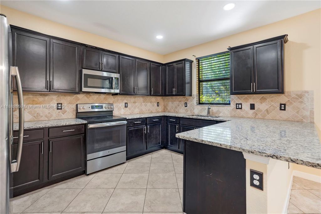 Photo of 6973 Broadland Way, Coconut Creek, FL 33073 (MLS # A11882659)