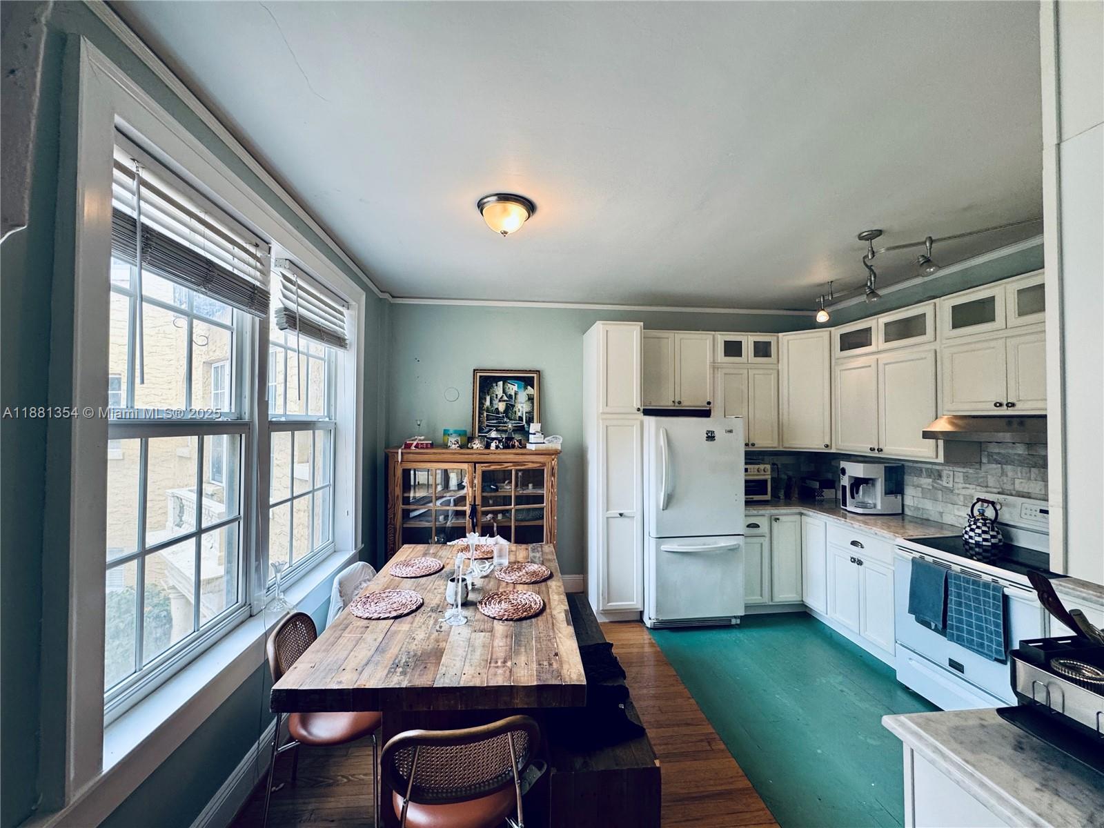 Welcome to historic Beverly Terrace Manor in Edgewater! This sun-drenched corner 1BD/1BA blends timeless charm with modern comfort. Enjoy an updated kitchen with custom cabinetry, granite counters, farmhouse sink, & room for a 6-person table perfect for entertaining. Original Dade pine floors flow throughout, complemented by 3 large closets, including a hidden one behind custom bookshelves. Unit comes with the 2 imported wooden pieces. One gated parking space included. The building features on-site laundry, landscaped courtyard, & a stunning Mediterranean Revival lobby. Prime location—2 blocks to Whole Foods, walking distance to shops and dining, with Midtown & Design District nearby. No pets. Quick approval! Available Oct. 4th.