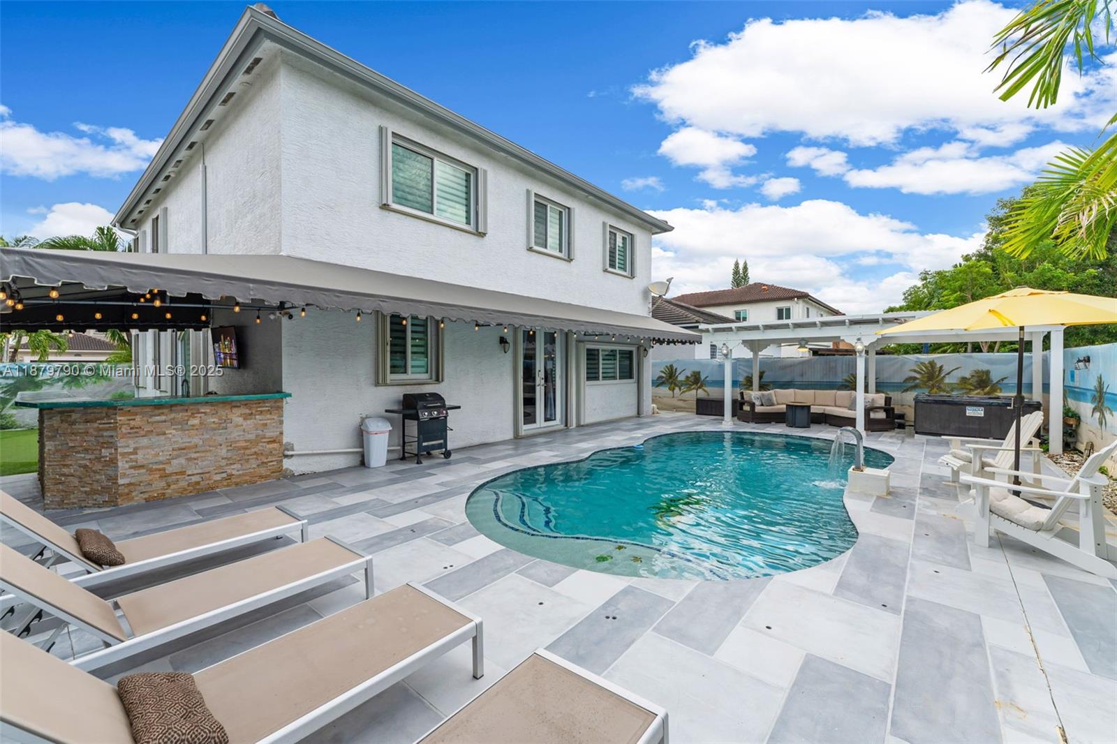 Welcome to this updated furnished 4-bedroom, 3.5 bath single-family home in the heart of Kendall, offering the ultimate lifestyle for relaxation and entertainment. Inside, the converted garage is a one-of-a-kind retreat featuring a private movie theater, pool table, domino table, and arcade machine - perfect for fun nights in. The open layout provides comfort and style, with spacious bedrooms and modern finishes throughout. Step outside to your backyard oasis complete with a sparkling saltwater pool, hot tub, putting green, and outdoor bar, ideal for gatherings or quiet evenings under the stars. This home blends, comfort, leisure, and resort-style amenities, making it a rare rental opportunity in one of Miami's most desirable neighborhoods.