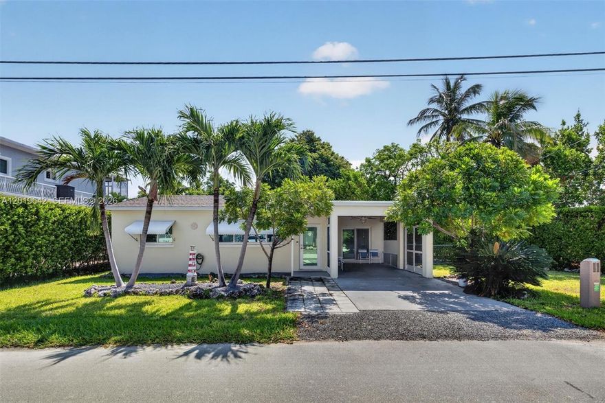 Charming Key Largo retreat offered at compelling land value pricing, creating a rare opportunity to enjoy immediate use while planning and constructing a brand-new elevated residence in one of the Florida Keys’ most desirable enclaves. In sought-after area and surrounded by magnificent waterfront and luxury estates, this property offers exceptional potential for redevelopment, investment, expansion, or the creation of a custom island dream home. The existing home is impeccably maintained, updated, and move-in ready, featuring timeless terrazzo floors, hurricane-impact windows and doors, newer appliances and systems, covered parking, tropical landscaping, and inviting indoor-outdoor living spaces. Whether utilized as a personal getaway, seasonal residence, rental income opportunity, or temporary residence during the planning and permitting stages of new construction, the current improvements add immediate value and flexibility. The spacious lot offers room for expansion, boat parking, outdoor entertaining areas, pool possibilities, or the development of a spectacular elevated Keys estate designed to maximize the tropical lifestyle and bay breezes. Ideally located less than an hour from Miami and near marinas, waterfront dining, boating, fishing, and world-famous Snappers restaurant, this property combines lifestyle, location, and long-term upside. A unique opportunity to secure a premium Ocean View Blvd address today while building for tomorrow. Your island vision begins here.