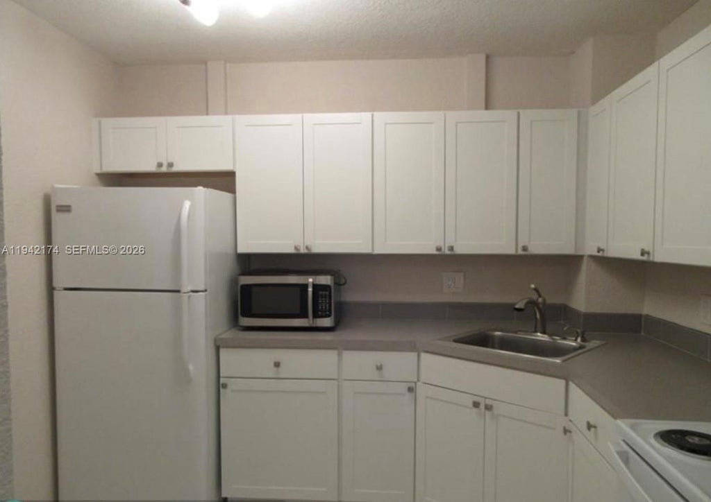 Photo of 10751 Royal Palm Blvd #17, Coral Springs, FL 33065 (MLS # A11942174)