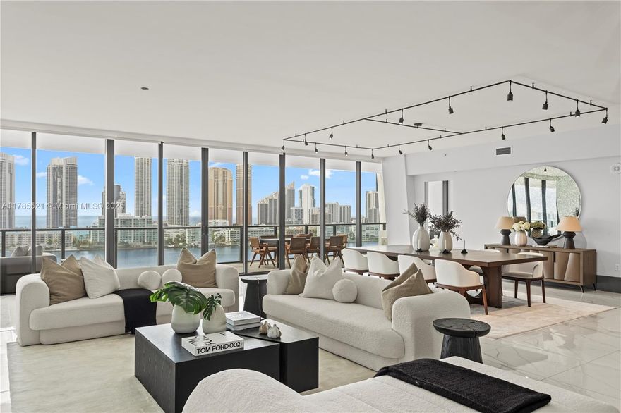 Experience elevated living at Privé Island in this spectacular high-rise corner residence. With over 4,000 sq ft, this 4-bedroom, 4.5-bath home showcases impeccable designer finishes and sweeping ocean and Intracoastal views from every room. A private elevator opens to a grand foyer, leading to spacious interiors with custom lighting, built-ins, and elegant wall coverings. Includes two parking spaces, a staff room, storage, and private marina access. Residents enjoy 70,000 sq ft of resort-style amenities—private restaurant, spa, dual gyms, tennis courts, pools, and more—all within a gated, private island community. This residence is unfurnished.