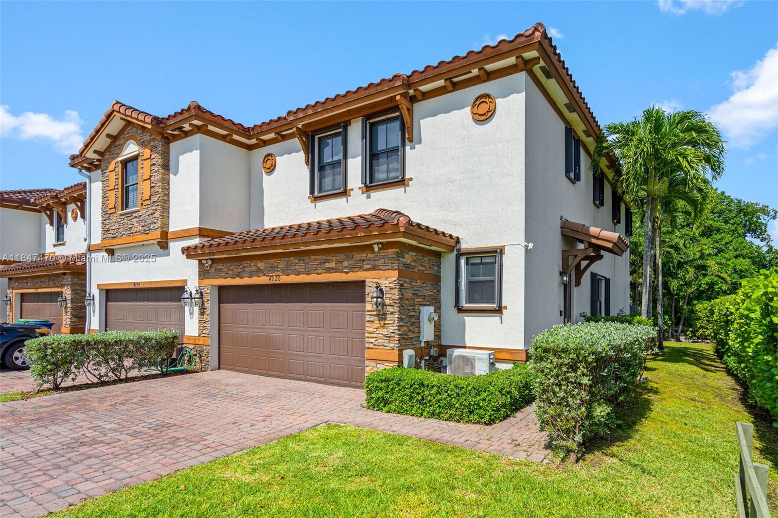 Welcome to this beautifully upgraded corner townhouse in a private enclave of just 60 Italian-style homes with stone facades and timeless charm, located in the heart of Kendall Lakes near Bird Road. Built in 2016 with great attention to detail, this spacious residence features a double-car garage, separate laundry room, and an open-concept kitchen with quartz countertops, luxury cabinetry, top-tier appliances, and a large wine cooler. Elegant upgrades include smart toilets, custom accent walls, and a private brick-paved patio with a modern pergola and no rear neighbors. The walled, family-friendly community offers lush landscaping, a central lake, and a resort-style pool with cabana and sundeck — creating the perfect blend of comfort, privacy, and lifestyle.
