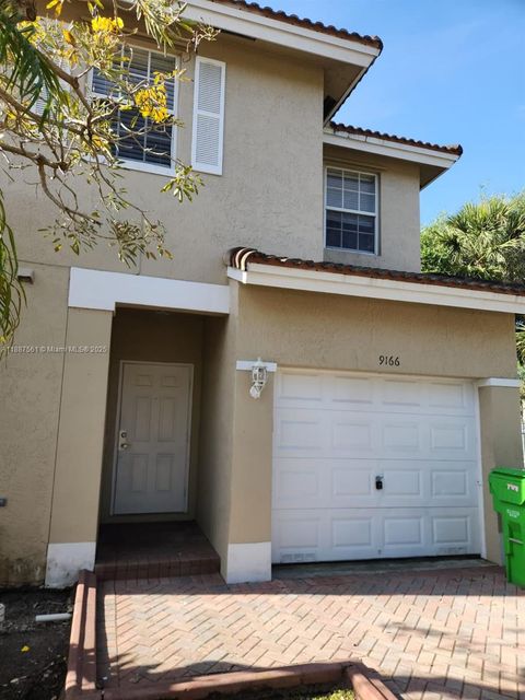Photo of 9166 NW 40th Pl, Sunrise, FL 33351 (MLS # A11887561)