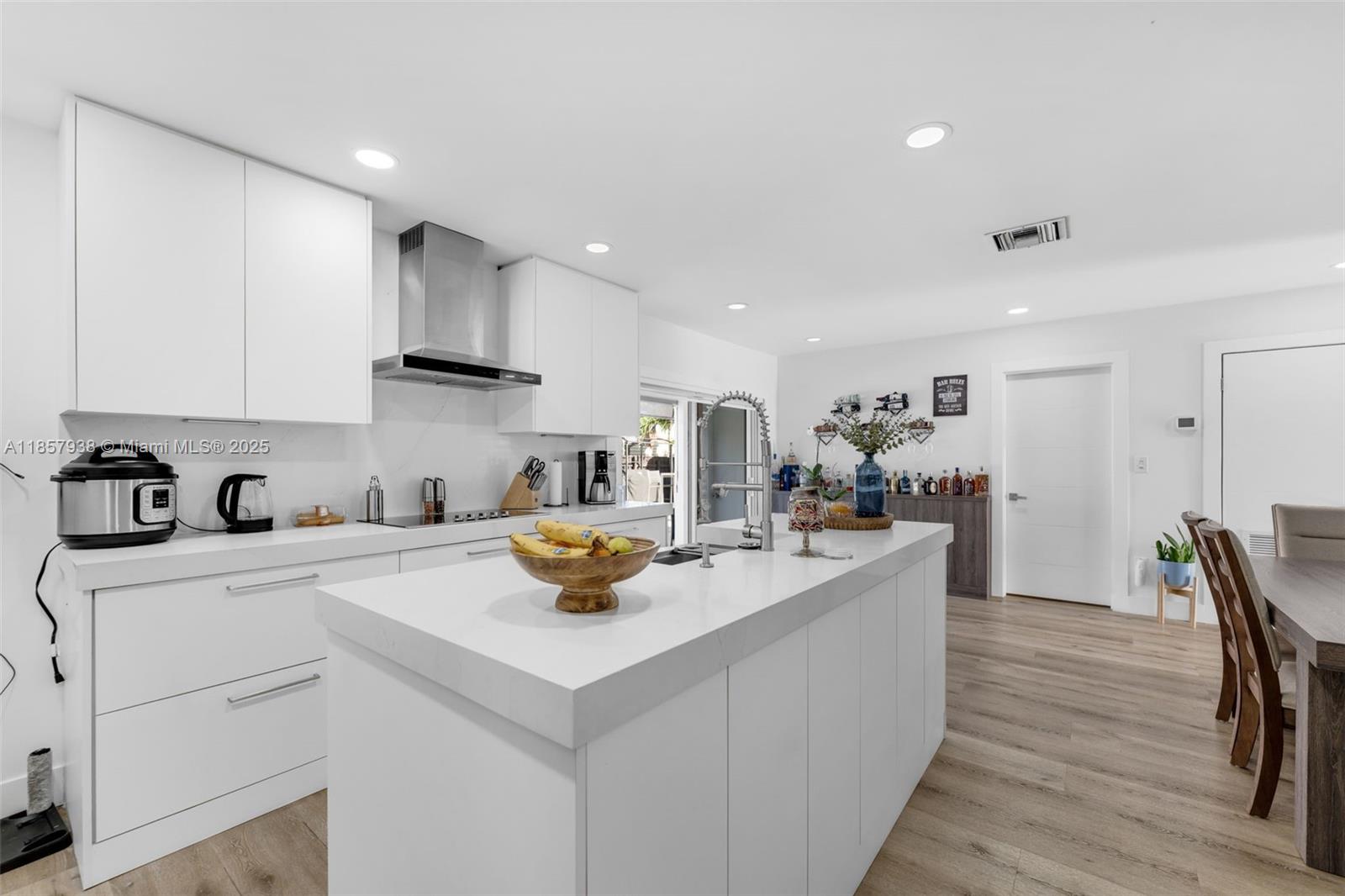 Move-in ready 2/2 in Royale Green and completely updated, this Miami gem features a new roof , new pool, all-new flooring, recently installed impact door and windows and modern finishes throughout. Enjoy an open-concept layout with a sleek designer kitchen, updated baths, and abundant natural light. Situated on a large corner lot with a huge yard and oversized driveway—perfect for multiple vehicles, a boat, or RV. The backyard is an entertainer’s dream with a sparkling pool, tiki hut, pergola, and tropical landscaping. Conveniently located near top schools, shopping, dining, and major highways. No HOA—total freedom to make it yours!