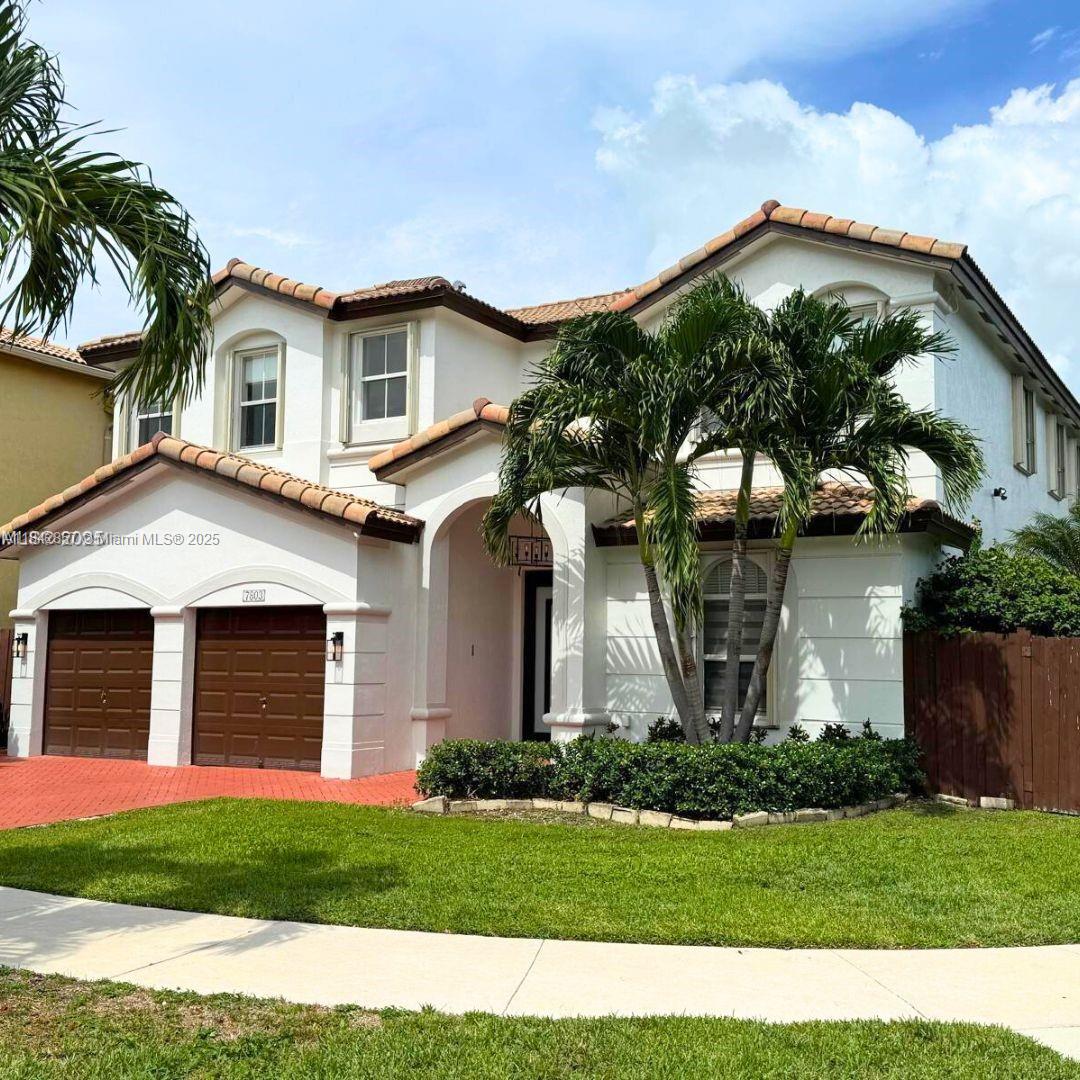 Step into style and comfort in this beautifully updated 4BR/4BA home in Isles at Doral. Positioned on a private corner lot with peaceful lake and fountain views, it’s ideal for everyday living and entertaining. Enjoy a brand-new 2024 saltwater heated pool with infinity jacuzzi, waterfall, and LED lighting—your own backyard oasis. Inside, soaring ceilings, great natural light, and an open-concept chef’s kitchen with large quartz waterfall island, state-of-the-art Samsung smart appliances, wine fridge, and space for a coffee bar under the microwave. Downstairs bedroom with full bath—perfect for an office, guest, in-law, or au pair suite. Upstairs: loft and 3 ensuite bedrooms, including a stunning primary retreat. Two-car garage, dual side gates, and space for a summer kitchen.