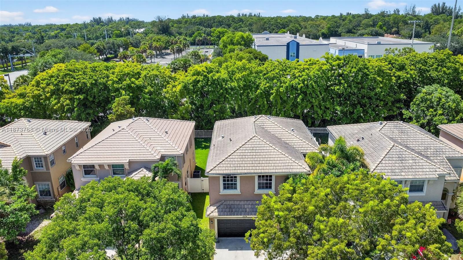 Spacious 5BR, 2.5BA home in Madison Green, Royal Palm Beach, with 3,347 total sq ft (2,768 under air). This property offers key 2023 updates plus room for customization. Upgrades include granite flooring on the first floor, marble-look porcelain tile, new baseboards, crown molding, modern lighting, and a Lennox energy-efficient HVAC. The kitchen features high-gloss cabinetry and a large island, prepped for marble countertops, waterfall edge, and farmhouse sink. Upstairs, a spa-style bath includes dual showers and a floating vanity, while the primary suite has ample space with a bath ready for your design. Outside, enjoy a private backyard with resurfaced pool/spa, decorative tilework, water spouts, and raised seating. Madison Green provides resort-style amenities, golf, and low HOA fees.