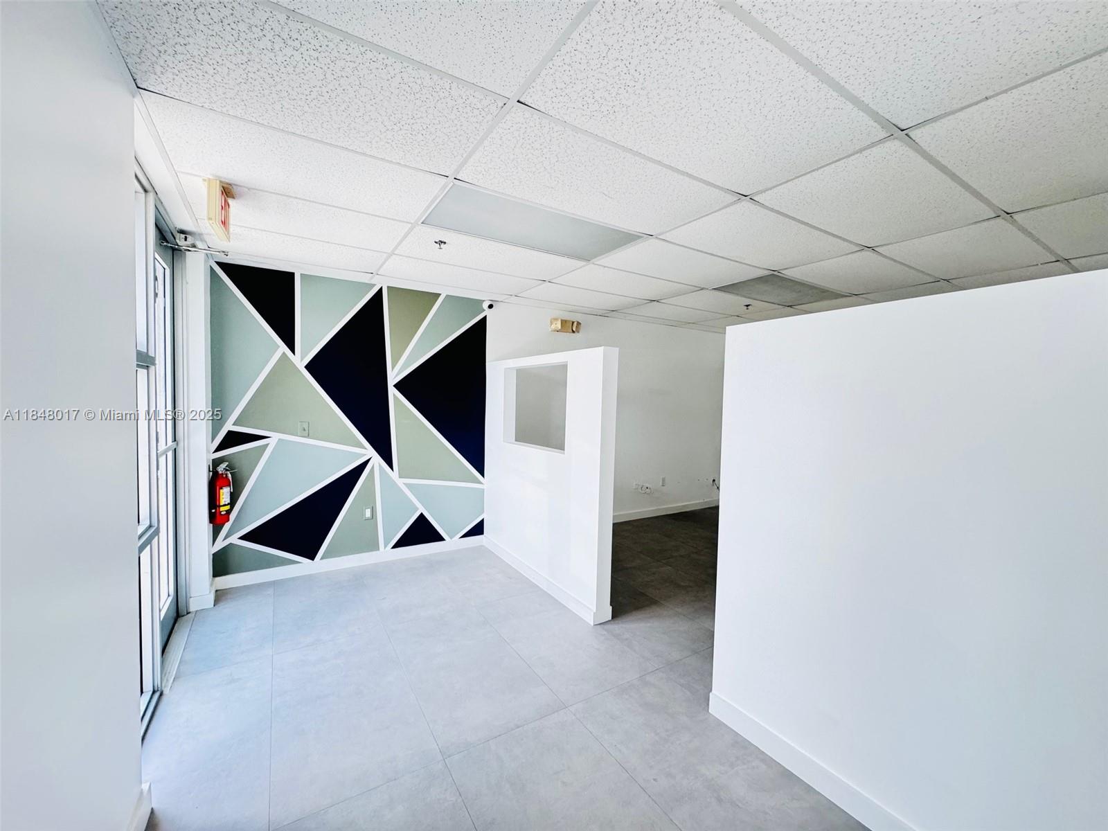 This well-maintained corner unit offers exceptional visibility in one of the area’s most sought-after industrial zones. The warehouse features a 20-foot roll-up door, 3-phase electrical, an ADA-compliant restroom, and a water connection, making it ideal for a variety of business operations. A mezzanine provides additional storage space, which .The front showroom and office area are bright, well-divided, and filled with natural light, creating a professional and inviting atmosphere. The warehouse has space to unload a 40-foot container, and the property includes three assigned parking spaces along with guest parking. Conveniently located near major highways and the airport, this property is perfectly positioned for logistics, distribution, or service-based businesses.