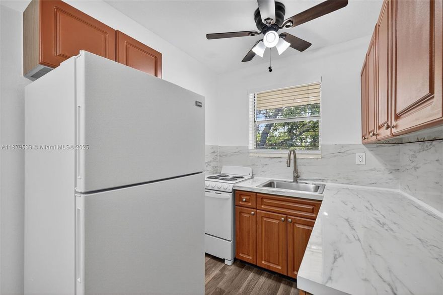 RAPID APPROVAL!! 1 bedroom, 1 bathroom located in the heart of Hialeah! This ample apartment features laminate flooring, freshly painted walls and open kitchen. Includes water and one assigned parking. Washer/dryer room separately available on premises. Minutes away from shopping plazas and major highways. Additional $25 monthly pet fee for small breed.
