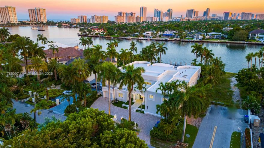 A luxurious property offering direct access to the Intracoastal with no fixed bridges.

Beautifully redesigned, this two-story mansion is located on the picturesque coast of Hollywood, FL. With 8 bedrooms and 6.5 bathrooms, it spans over 7,000 square feet of living space. Featuring a 100-foot seawall and a 50-foot boat dock, located on over half an acre of land, it provides unparalleled water access.

The property includes spacious exterior staircases leading to a large backyard, a vaulted ceiling foyer, gourmet kitchen, chef-fireplace-bar, marble and wood floors, stairs, elevator, balconies, covered outdoor pavilions, pool, and spa cabana