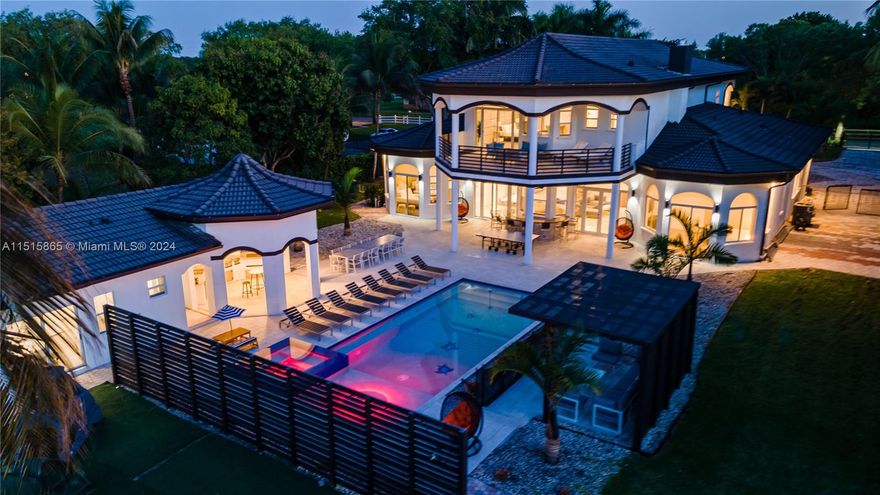 Impressive mansion located in an exclusive neighborhood in Davie. This luxurious residence offers over 6000 square feet of modern, open-concept living space. With 8 spacious bedrooms, 4 luxurious bathrooms, a cinema room, game room, and vaulted high ceilings, this residence is designed to provide maximum comfort. The fully equipped chef's kitchen is perfect for culinary enthusiasts. Step outside and discover your own private paradise with a beautiful heated pool, jacuzzi, and a built-in barbecue area. The property also includes a guest house, ample parking, and complete privacy.