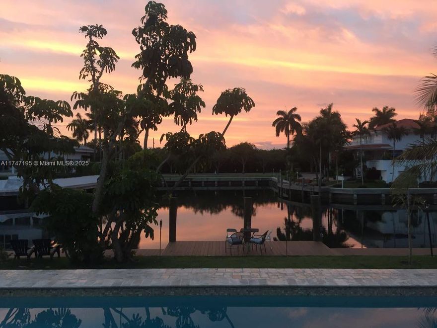 Welcome to your dream waterfront home in the prestigious guard-gated community of Gables by the Sea. This beautiful house features modern finishes, an updated kitchen w/ quartz countertops, 4 spacious bedrooms (2 en-suites), a home theater/den that can double as a 5th bedroom, and 3.5 bathrooms. Enjoy the safety and tranquility provided by impact windows and doors, covered outdoor area, and more. The private designer dock and seawall offer the perfect spot to witness breathtaking sunrises and sunsets. As night falls, the underwater lighting turns your dock into a mesmerizing display, showcasing the marine life and creating the ambiance of your own personal aquarium. The property is situated on an elevated lot, facing the wider side of the canal. Located near top-rated A+ schools.