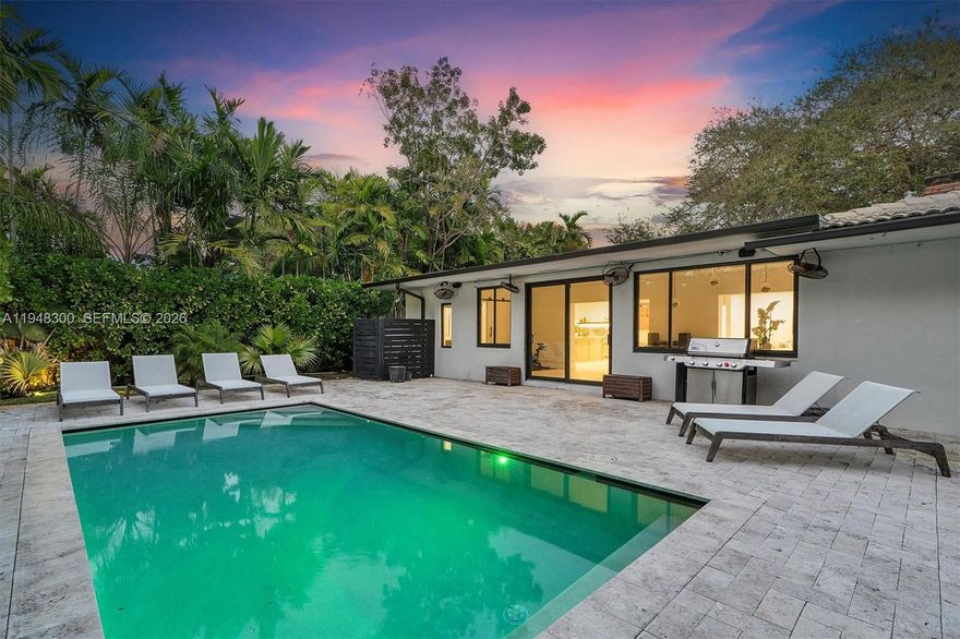 Quintessential Miami Shores Home! Located on a private street w/no through traffic. House is surrounded by mature trees giving it a sense of peace & serenity. Chef-inspired kitchen w/huge dolomite countertops island, Fulgor Milano gas range, wine cooler & tons of storage/cabinets. Enjoy spectacular views of your brand new pool w/lush landscaping from living/dining areas. Split bedroom plan. Spacious master suite that has a walk-in closet w/tons of natural light. The Master bath has 2 sinks, rain shower, and a tub. Separate laundry room. All impact windows & doors. 2 car garage. EV charger. A must-see!!