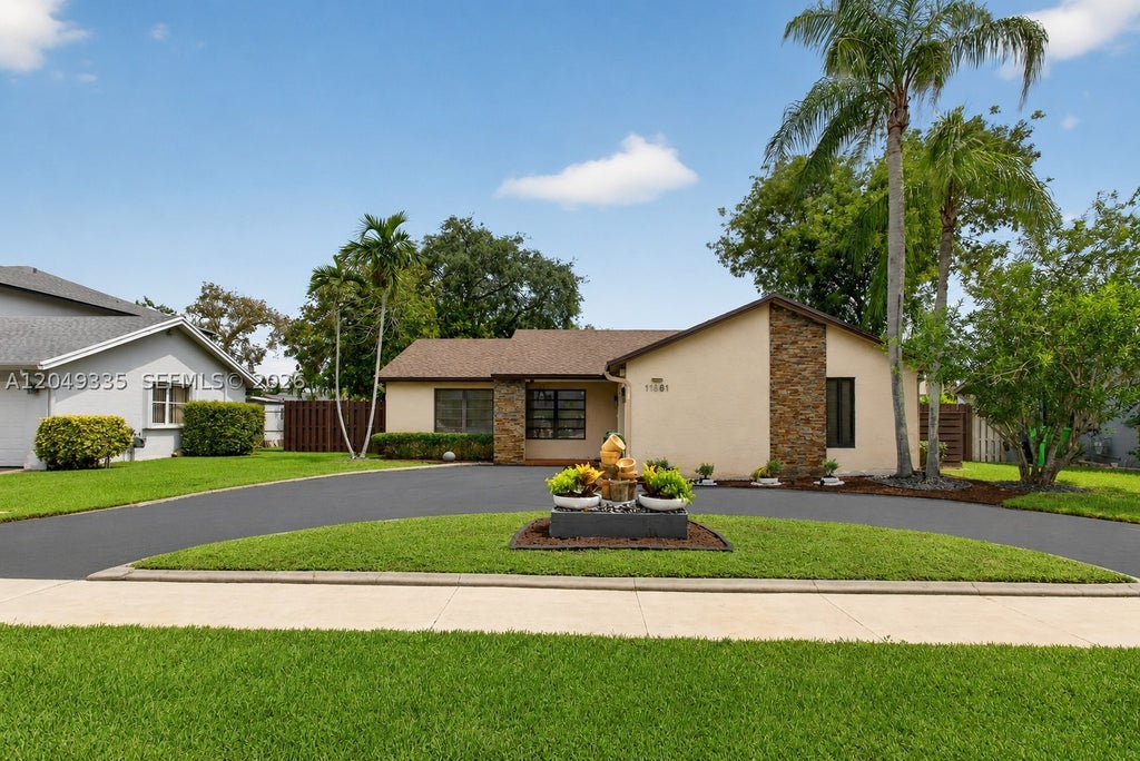 Photo of 11861 NW 41st St, Sunrise, FL 33323 (MLS # A12049335)