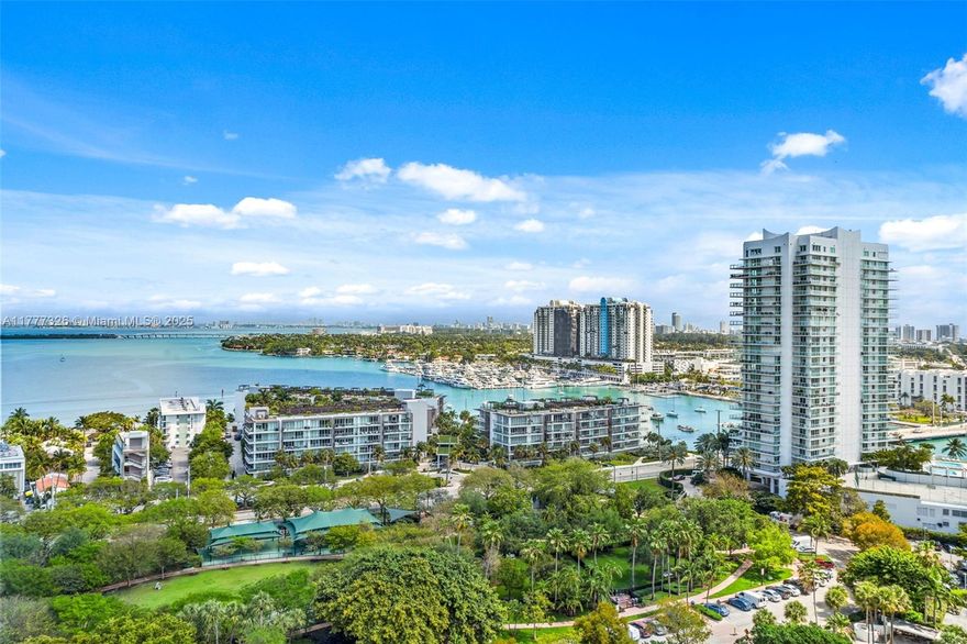 This 2 Bedroom 2 Bathroom condo at Nine Island Avenue has updated kitchen, New Impact Windows, and partial bay views. Enjoy views of Belle Isle Park and Bay Views from your balcony. This condo has  Brand New Impact Windows. Unit has Covered Parking and Extra Storage Space Nine Island Avenue is a Luxury Full Service Building, Common spaces have been beautifully updated with Terrazzo Floors in lobby and Mezzanine levels. State of the art Fitness Centre, free movement room, Children's Play area, Tennis Courts, Boat Slips, and Community Room overlooking Biscayne Bay.