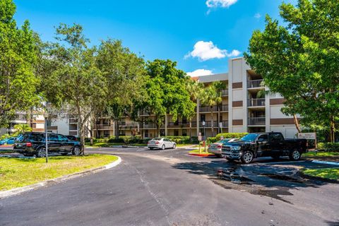 Photo of 100 NW 76th Ave #404-2, Plantation, FL 33324 (MLS # A11919460)