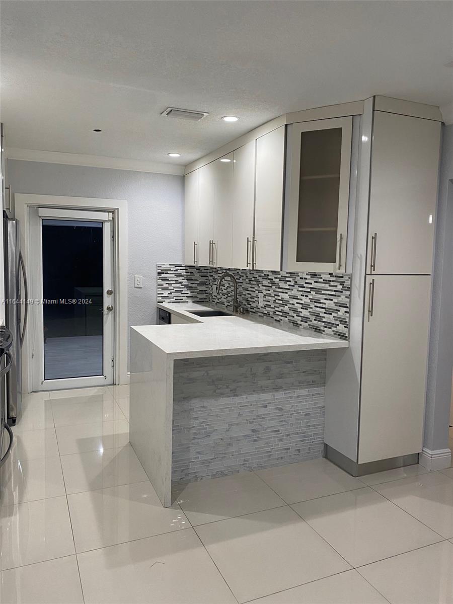 2/2 SINGLE FAMILY HOME IN AN EXCELLENT LOCATION! ELECTRICITY, WATER AND INTERNET INCLUDED IN RENT. WASHER AND DRYER INSIDE THE HOUSE! IMPACT WINDOWS, MODERN METAL ROOF, NEW KITCHEN AND BATHROOM. COME AND SEE THIS BEAUTY BEFORE ITS GONE! OUTDOOR KITCHEN TO ENJOY WITH YOUR FAMILY AND FRIENDS!