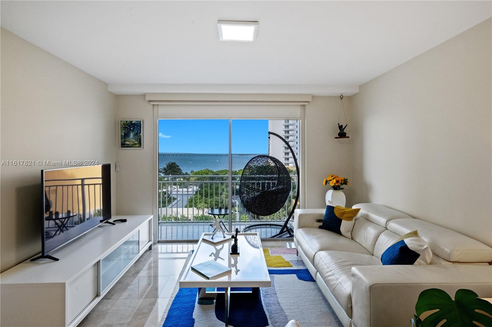 Renovated Isola condominium with remodeled heated pool, new tennis court/Pickleball, BBQ area, jacuzzi, mini golf, meditation garden, ping pong area, and outdoor bar with bay view. Includes children’s play area, bicycle storage, 24-hour concierge and valet services, business center , club room with water views, mini market, car wash, and remodeled fitness center. Split design 2/2 with breathtaking water and city views. Features marble flooring throughout, an updated open kitchen with granite countertops, stainless steel appliances, new modern doors, and skirting boards. Master suite with walk-in closet, blackout blinds in bedrooms, and electric blinds in the living room. Sold with Italian furniture from Modani brand. SELLER WILL PAY ALL PENDING SPECIAL ASSESMENTS AT TIME OF CLOSING