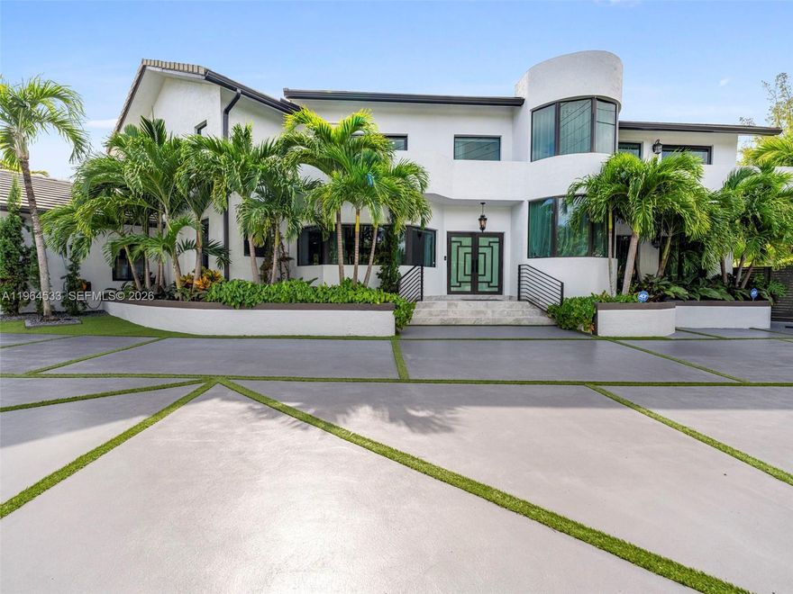 Tastefully renovated in 2024, this sophisticated residence is situated on an oversized 12,000 sqft corner lot in the prestigious Pine Tree Drive corridor. Designed for both luxury living and entertaining, the home features a resort-style backyard complete with pool, jacuzzi, cabana, and summer kitchen surrounded by lush tropical landscaping.The designer chef’s kitchen is appointed with sleek quartz countertops, custom cabinetry, premium Miele appliances, and a built-in wine cooler. Interior living spaces are enhanced by high-end finishes, including a statement Maria Teresa crystal chandelier that elevates the home’s elegant ambiance.The home offers 3 bedrooms upstairs plus an additional handicap-accessible bedroom on the main level — ideal for guests, in-laws, or multigenerational living. The expansive primary suite features two private balconies — one overlooking the front grounds and another facing the resort-style pool — along with a 65-inch TV, creating a serene retreat.
Additional highlights include a private home theater system, spacious living areas filled with natural light, and a two-car garage. This fully updated residence offers a refined blend of modern comfort and timeless sophistication in one of Miami Beach’s most sought-after residential neighborhoods.Oversized Backyard Heated Pool & Spa Renovated 2024 2 Blocks from the Beach Miele Appliances Media / Entertainment area 2 Car Garage.