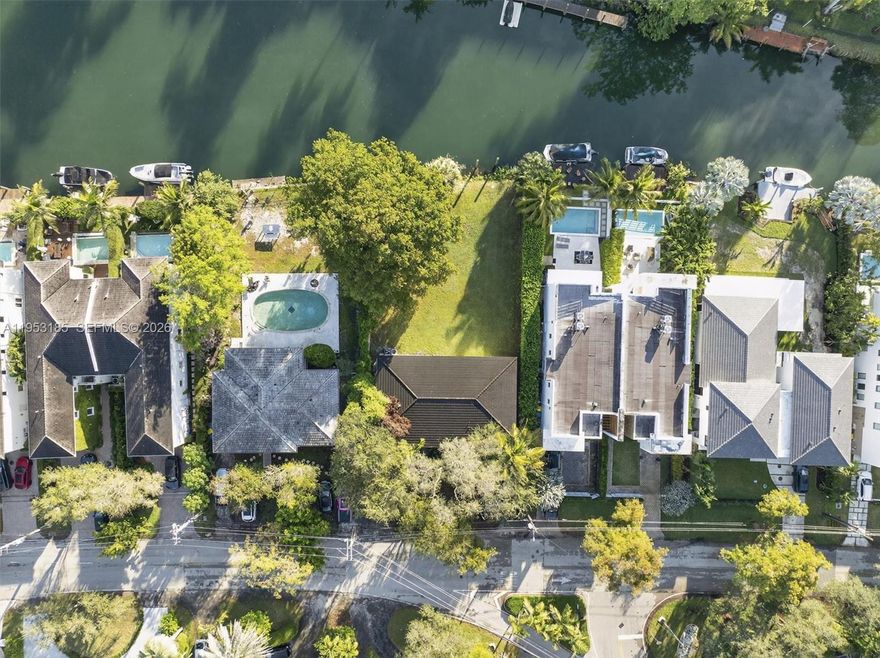 Rare waterfront opportunity along the Coral Gables Waterway. This unique offering consists of two condo units within a single structure, positioned on an oversized waterfront site ideal for redevelopment into a bespoke luxury residence. And the addition or dock(s) and boating structures. The property offers direct water frontage in a quiet residential enclave surrounded by high-end homes, presenting exceptional long-term value in one of Coral Gables’ most prestigious neighborhoods. Currently income-producing with leases in place, allowing a buyer to offset holding costs while planning, designing, and permitting a future redevelopment. Opportunities of this scale, orientation, and flexibility are increasingly scarce. Ideal for a luxury end-user builder or buyer seeking to create a one-of-a-kind waterfront home with privacy, indoor-outdoor living, and enduring architectural appeal. NOTE THERE ARE 2 FOLIO NUMBERS THE SALE INCLUDES FOLIO #03-4119-020-0020