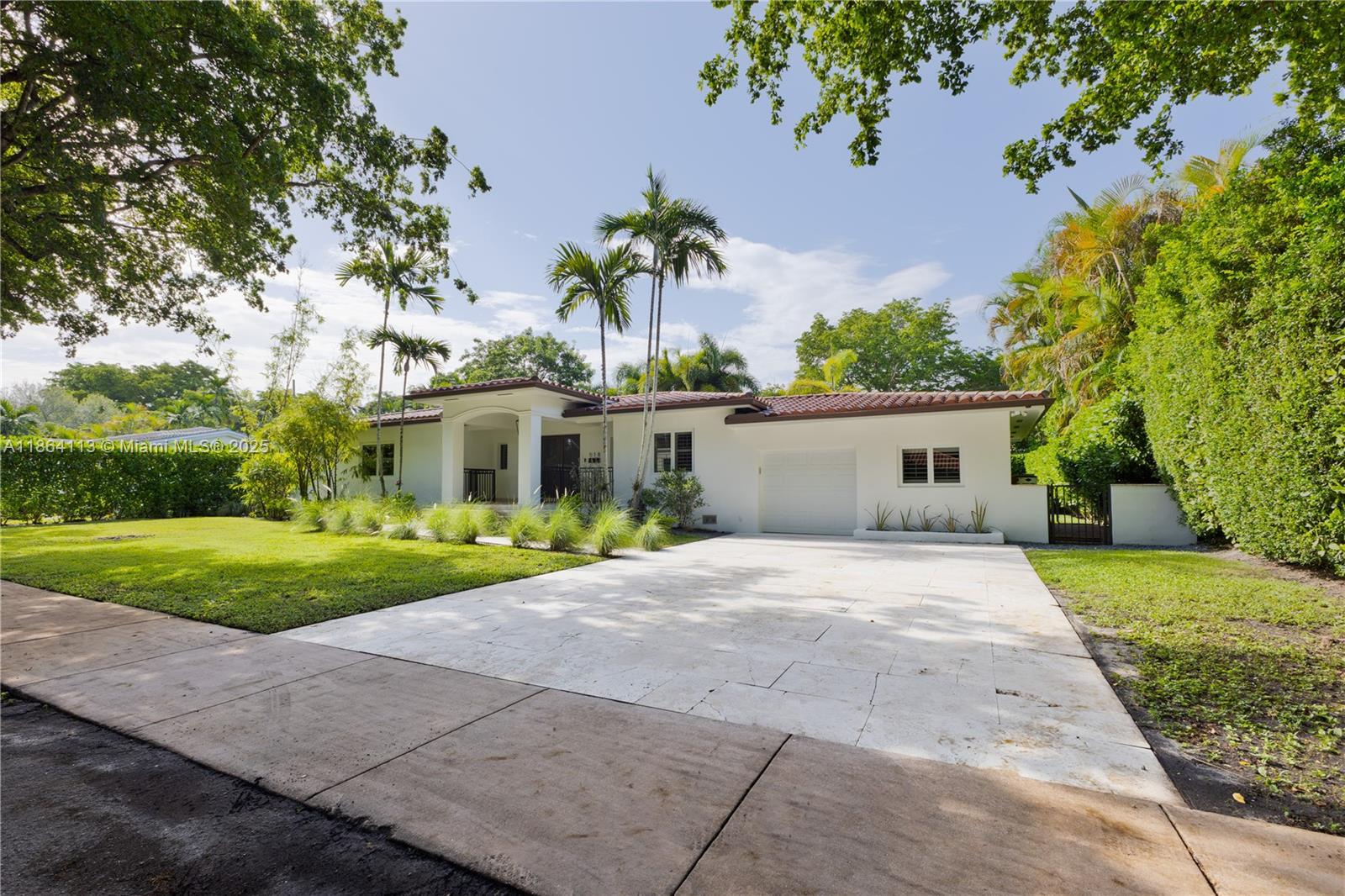 Located east of US-1 in coveted Coral Gables, this elegant residence sits on a manicured 10,000 sq ft lot with timeless curb appeal and privacy. Featuring 4 bedrooms and 3 baths, the home showcases a bright, open layout where living, dining, and family areas flow seamlessly to the garden, pool, and private putting green. Interiors highlight rich wood and marble floors, impact windows, new appliances, and a dedicated laundry area. Outdoors, enjoy resort-style living with a sparkling pool and lush entertaining spaces. With a one-car garage and move-in ready condition, this home offers the perfect balance of elegance, comfort, and location—an exceptional lifestyle opportunity in prestigious Coral Gables.