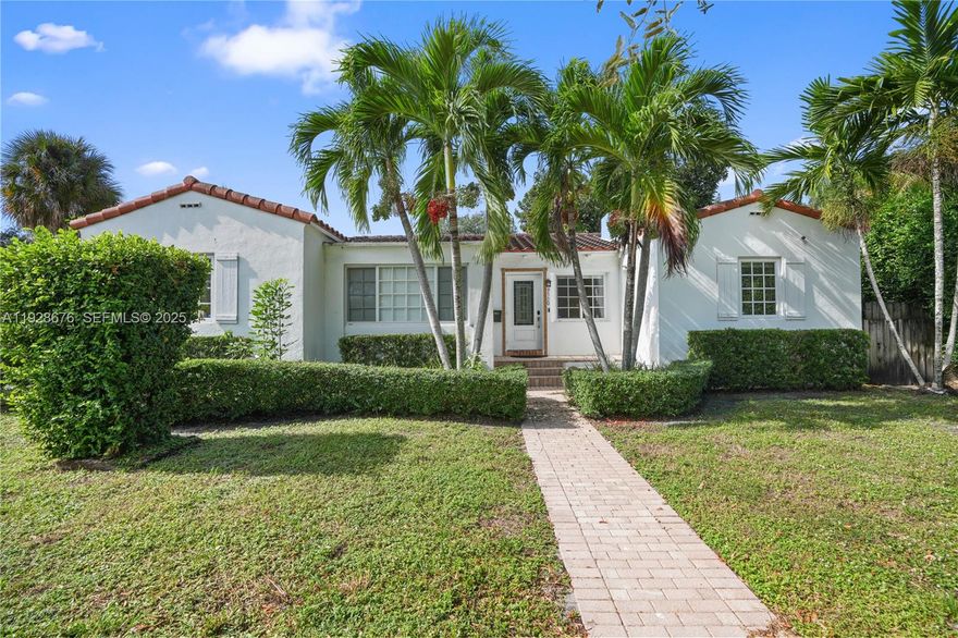 This Mediterranean-style corner home features full hurricane-impact windows and doors, including a new impact sliding glass door off the kitchen. Totaling approximately 1,875 sq. ft. including the garage, the property offers a newly built 20x40 heated pool with a digitally controlled Wi-Fi hot spa and a freshly painted exterior. Inside, the home showcases cathedral ceilings, abundant natural light, updated finishes, stainless steel appliances, and turnkey furnishings that may remain. The layout includes three spacious bedrooms—two with queen beds and one with a king—along with two modern full bathrooms with jet showers. Additional features include a dining area with seating for eight, an alcove currently used as an office and daybed space, and a decorative mantel-style fireplace. A two-car garage, an enclosed backyard, and a front yard complete this well-maintained property.