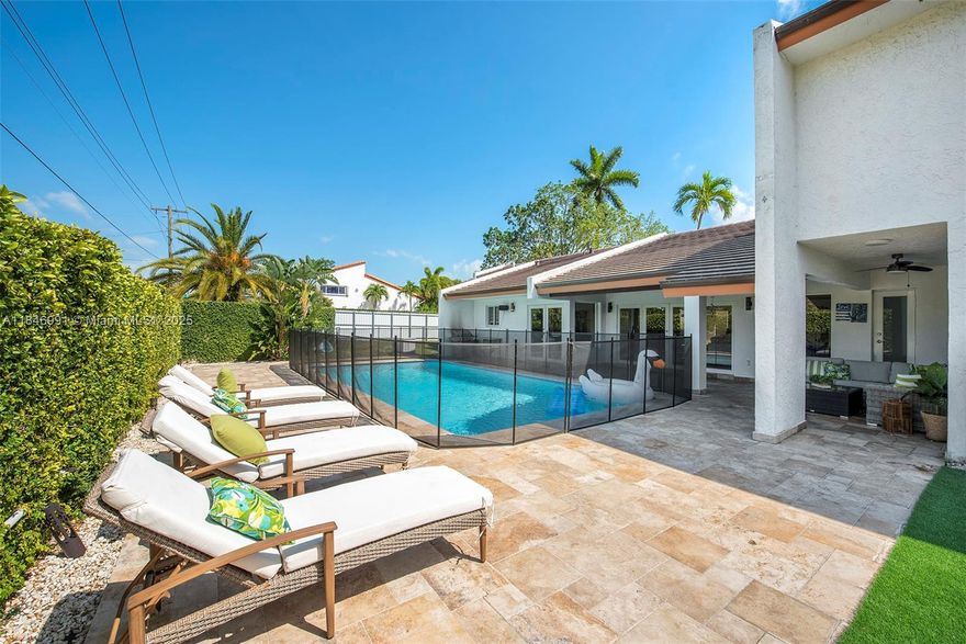 UNDER 1 YEAR LEASE. The house is available for rent UNTIL July 15 2026. Beautiful, spacious, modern home with a big pool for the family and friends to enjoy.  It's located in the walled community of Gables Edge in SOUTH MIAMI, blocks away from University of Miami and A+ school. Open living room with marble floor through out, leading to the terrace and pool deck. A custom design kitchen with modern appliances, wall oven, wine cooler, quartz countertop with the island and access to the patio. Tesla charger, solar roof, pool, impact windows and doors are some extras this property offer