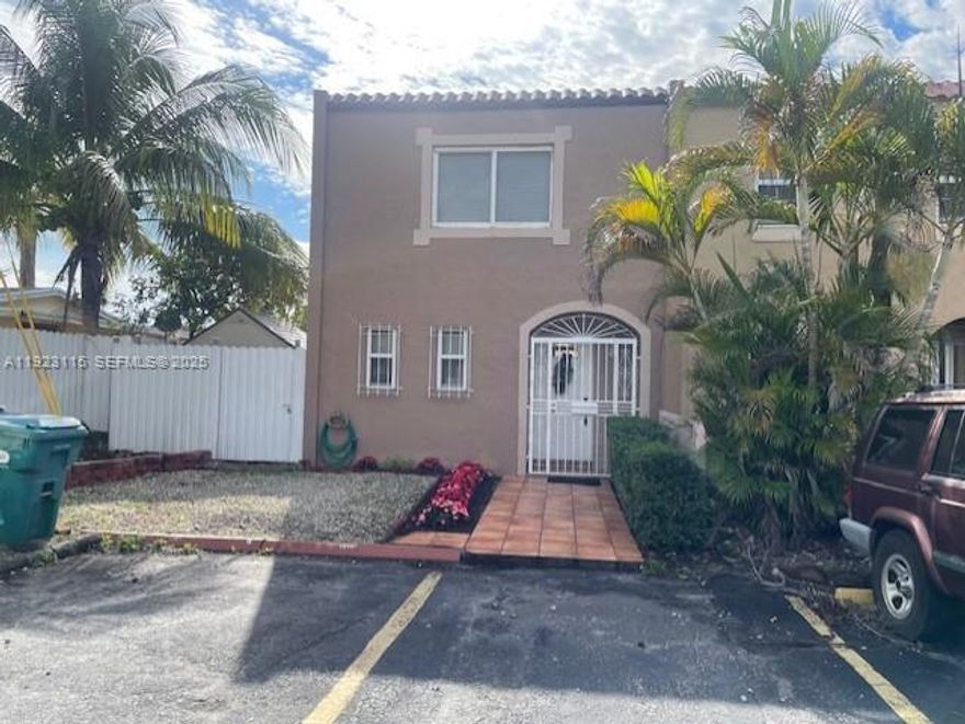 Beautiful 2-story corner townhouse that feature a spacious living room, dining room, modern update kitchen, 2 bedrooms, 1.5 baths , utility room, ceramic tiles & wood floors, central air, large fenced backyard, property is with a side entrance plus an additional door that exit to the back street easily converted to a car door for an extra parking. H.A.O is monthly $30 from January-October, November and Dec are free of change. Security cameras installed around the property. New metal fence around the property. Roof with insulation system that help keeping the property cool and save energy (with permit) AC- impact windows and doors , water heaters, refrigeration, microwave and oven, centrally located near shopping, school, houses for worship and major highway. Sold in "AS IS" condition