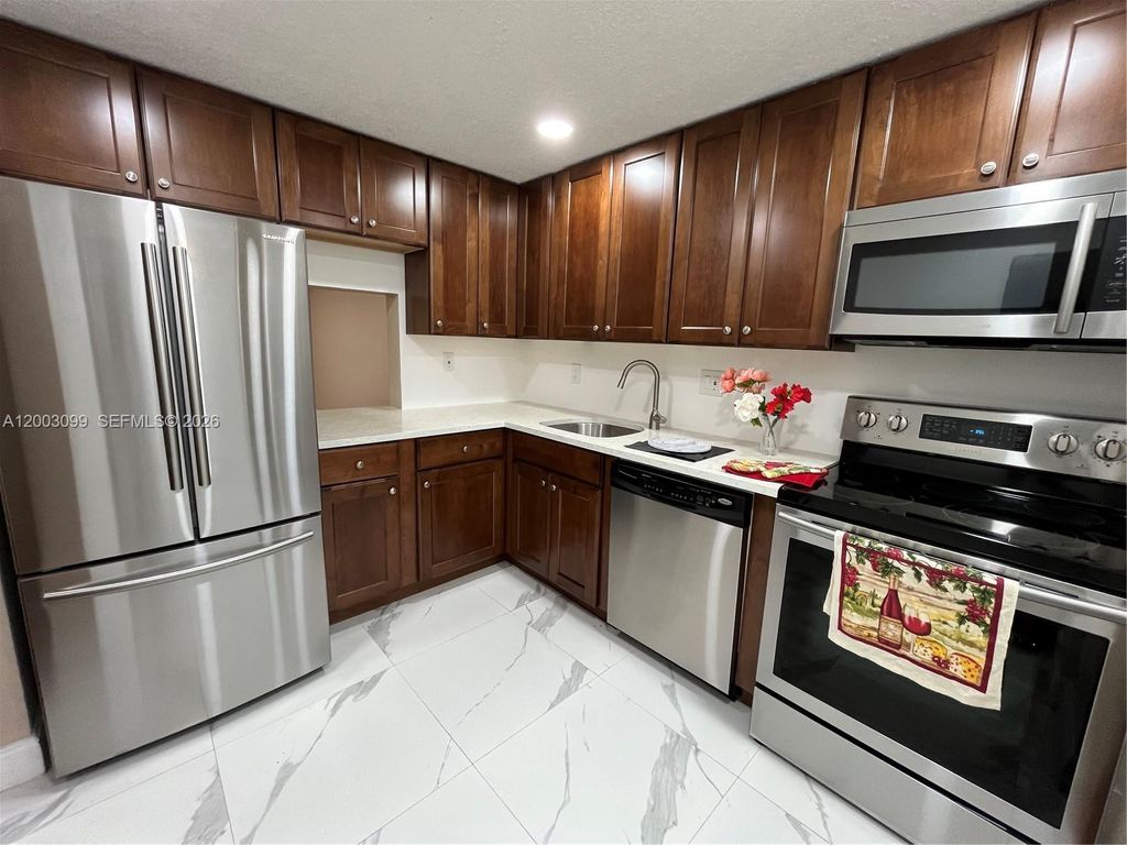 Photo of 7900 S Colony Cir S #204, Tamarac, FL 33321 (MLS # A12003099)