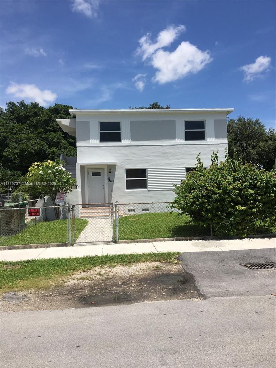 Remarkable 2 story centrally located triplex with brand new roof. Impact windows throughout this spacious 3 unit duplex offering two 3 bed/1 bathroom identical units plus a separate 1/1 with laminate flooring, updated kitchens, large patio and plenty of parking spaces. Laundry room on first floor. Central AC. Separate water and electrical meters. Tenants are on a month to month and rented way below market value. Also for sale 2320 NW 15 St across the street.