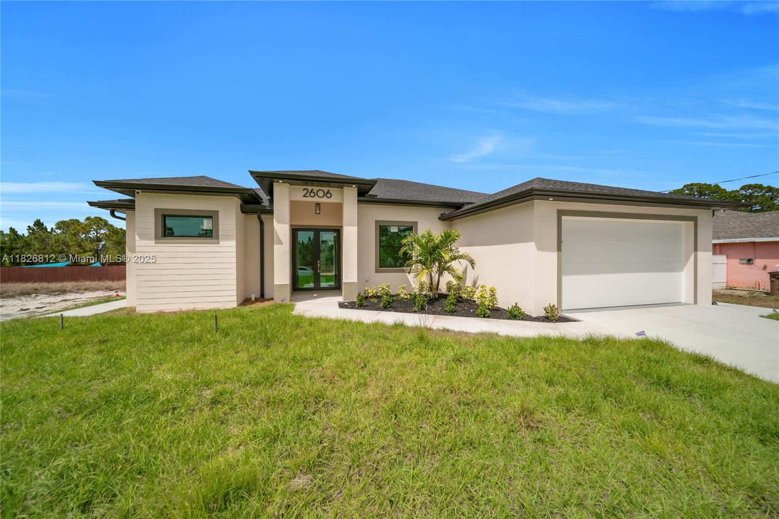 Stunning New Construction Home in Lehigh Acres! SELLER CONCESSIONS OFFERED!! Discover this beautifully designed 4-bedroom, 3-bathroom home with a 2-car garage, conveniently located near State Road 82, schools, and shopping. This modern home offers a spacious open-concept layout, perfect for comfortable living and entertaining. The stylish kitchen features quartz countertops, stainless steel appliances, upgraded modern fixtures, and porcelain tile throughout. A security system surrounds the property for added peace of mind. With sleek finishes and high-end details throughout, this home is a must-see. Don't miss out on this move-in-ready home in a prime location. Schedule your showing today!