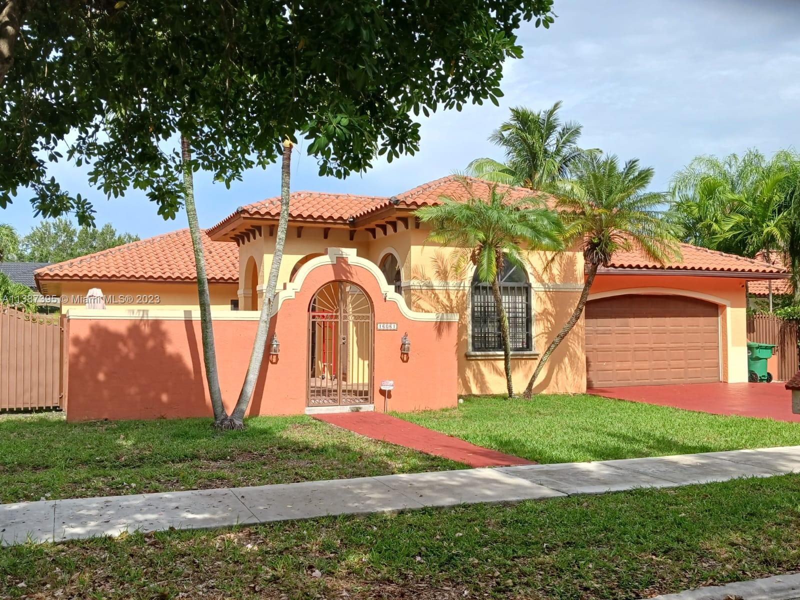 Magnificent home in the prestigious Royal Oaks Area gated community, in Miami Lakes. 4 bedroom 2 1/2 ***No HOA***, on a quiet street. The Open floor plan features high volume ceilings, allowing for natural light, a spacious living room, a large family room, 42' kitchen cabinetry, newer efficient AC and water heater systems, tile floors, and freshly paved ample courtyard entry. Room for a pool. Proximity to great schools, restaurants, shopping & more. Don't miss out on this great opportunity!