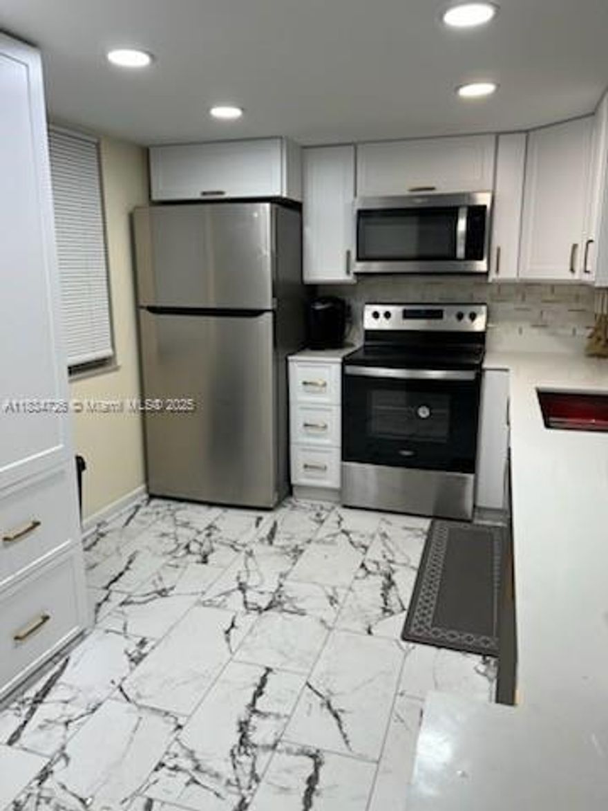 Spacious 2 bed/2 bath short term or Airbnb rental. Screened balcony with lake view. All white tile, lot's of closets. Very well maintained quiet community 1 mile to the beach. Heated pool. Walking trail with exercise equipment. Shopping, dining banks and casino all close by. 10 minutes to the airport.  two parking spaces. No pets.