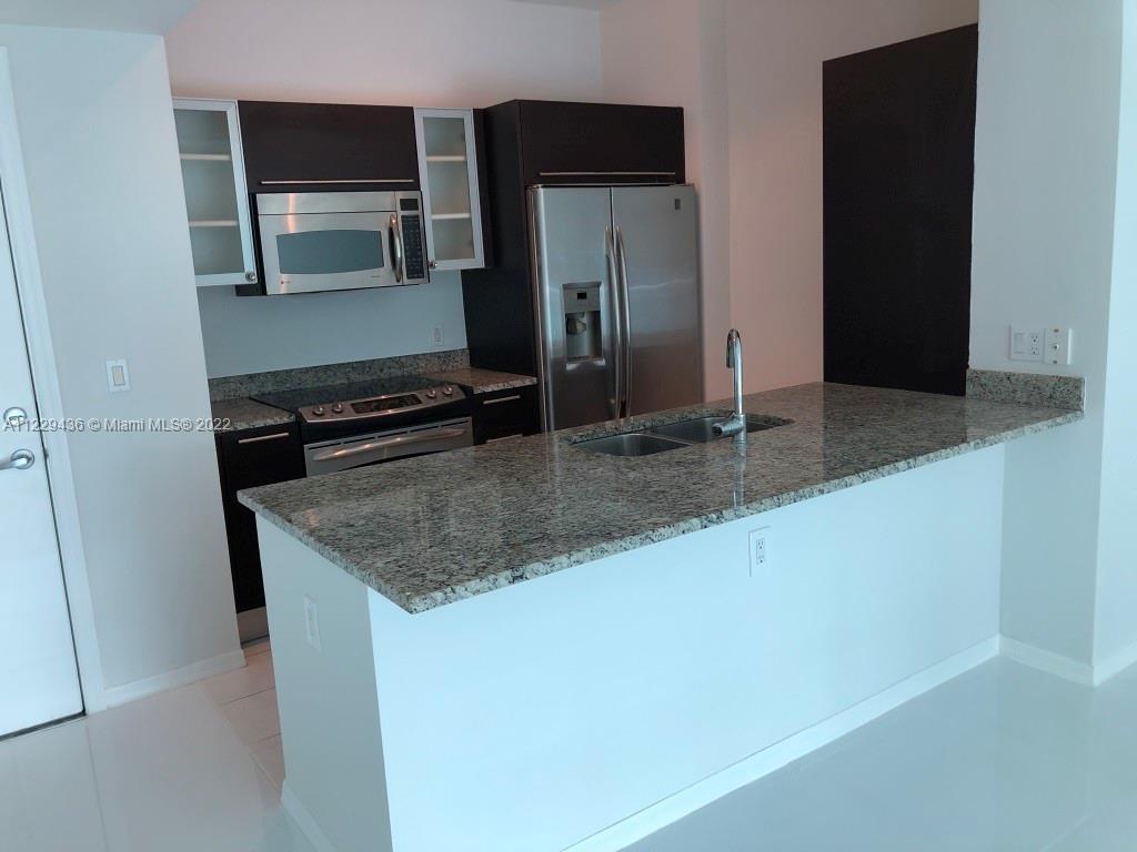 THE PLAZA 901 BRICKELL CO - Residential Lease