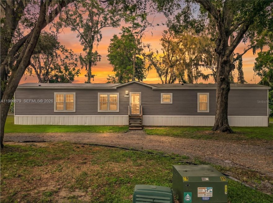 SELLER IS VERY MOTIVATED!! NO HOA and NO lot rent, you own the property! This beautiful home sits on almost half an acre shaded by oak trees, featuring a circular driveway with extra parking for your boat or RV. Inside, upgrades include an electric fireplace, large windows, and an open-concept kitchen with a granite island perfect for entertaining. The split-bedroom layout offers a private master suite with dual sinks, a garden tub, and a separate tile shower, while the additional bedrooms are spacious and versatile. With indoor laundry, a huge backyard for gatherings, and a prime location near I-75, Hwy 200, shopping, hospitals, and entertainment, this home is a rare find in Ocala. Schedule your showing today