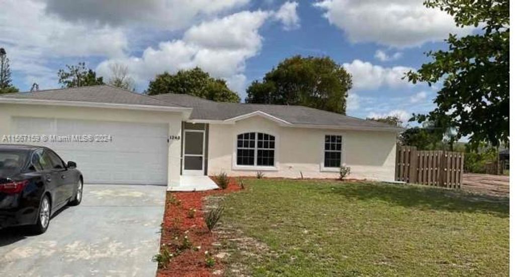 Photo of 1243 SW Empire St, Port Saint Lucie, FL 34983 (MLS # A11567159)