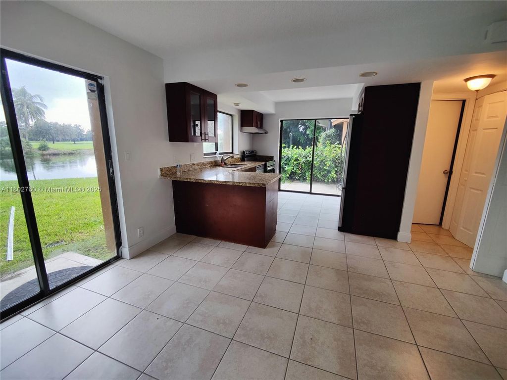 Photo of 181 Wimbledon Lake Dr #181, Plantation, FL 33324 (MLS # A11802760)