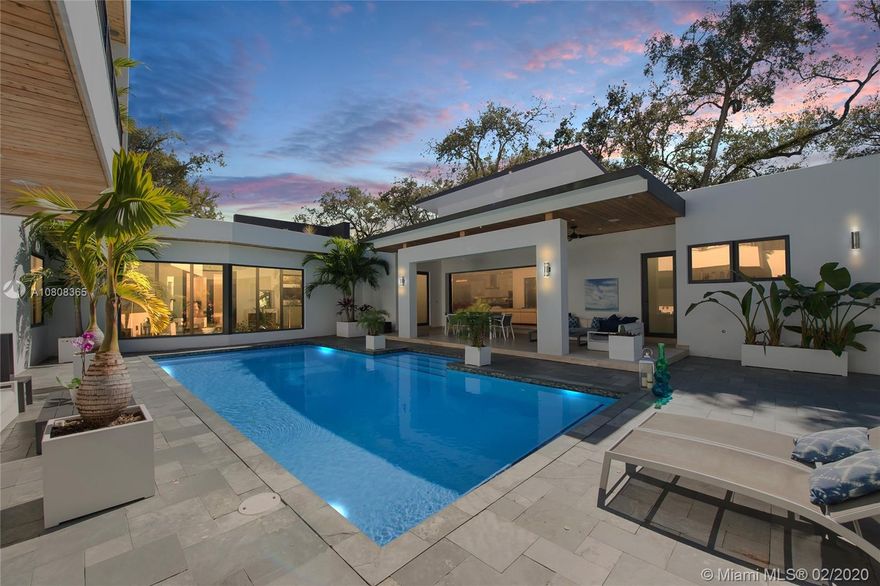 Exceptional price for an exceptional new modern house! A main house with 3bed/3bath plus a separated cabana with 2 rooms nested among majestic oaks and a sumptuous banyan tree on a double gated corner lot.
In the heart of south Miami, walking distance from restaurants, shops, fitness, movie theater, This house is a private peaceful retreat offering a unique modern experience, with natural sunlight everywhere. Built in 2015, huge open plan concept, massive kitchen island, top of the line fixtures and Thermador appliances, large family room, formal living room, laundry room, two car garage, Wired SMART house and sounds system, covered patio perfect for entertaining, beautiful heated swimming pool, and concrete roofs offering the lower risk category for hurricane insurance, it is a must see!