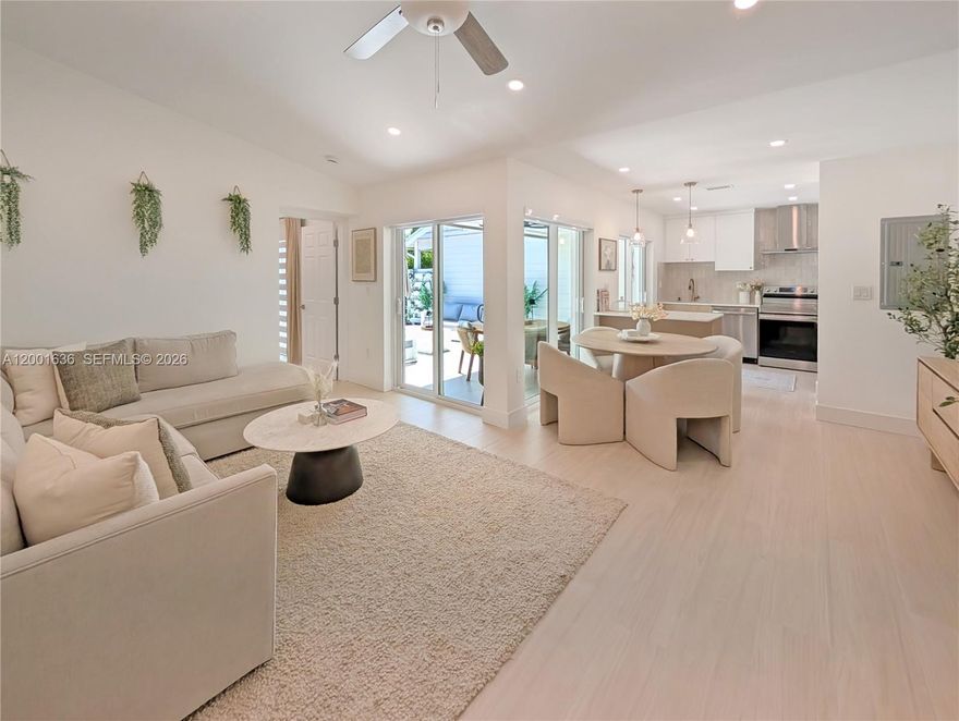 Welcome to Country Walk - where this immaculate 2/2 has been remodeled from the ground up with an uncompromising eye for quality and craftsmanship that simply sets it apart.

Every major system is already done: new roof (2025), A/C (2020), tankless water heater (2022), brand-new electrical breaker box, and completely new plumbing - with zero polybutylene pipes. This is the worry-free ownership buyers search for.

Inside, large-format porcelain wood-look tile flows throughout, and custom zebra blinds frame every window with effortless style. The kitchen is the showstopper - a wall was removed to open the living space to a dramatic island, two-tone slim shaker cabinetry in natural wood and crisp white, a custom quartz countertop, a striking contrasting tile backsplash, and brand-new appliances. No detail was overlooked.

The primary suite delivers a true retreat: a spa-inspired bathroom floored in designer Edward Martin matte porcelain - a stunning marfil and calacatta checkered pattern - paired with a lighted vanity mirror with defogger and adjustable light settings, and a generous walk-in closet. Step outside to over 500 sq ft of private outdoor space finished in Rosemary Frost porcelain - an entertainer's dream with room for family and friends alike. Hurricane-impact sliding doors and windows throughout. Two dedicated parking spots right at your front door.

This level of craftsmanship rarely hits the market. See it today before it's gone.